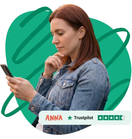 Small business owner checking her ANNA business account on her phone, rated Excellent on Trustpilot