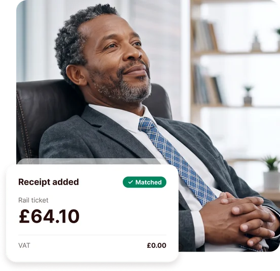 Business owner relaxing in an office chair, with an ANNA card showing a £64.10 rail ticket receipt added and matched