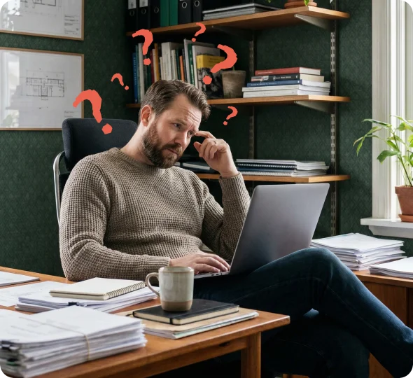Business owner struggling with accounting paperwork at desk