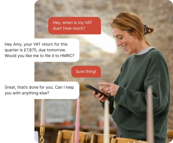 Business owner using ANNA Auto Accountant chat on mobile phone